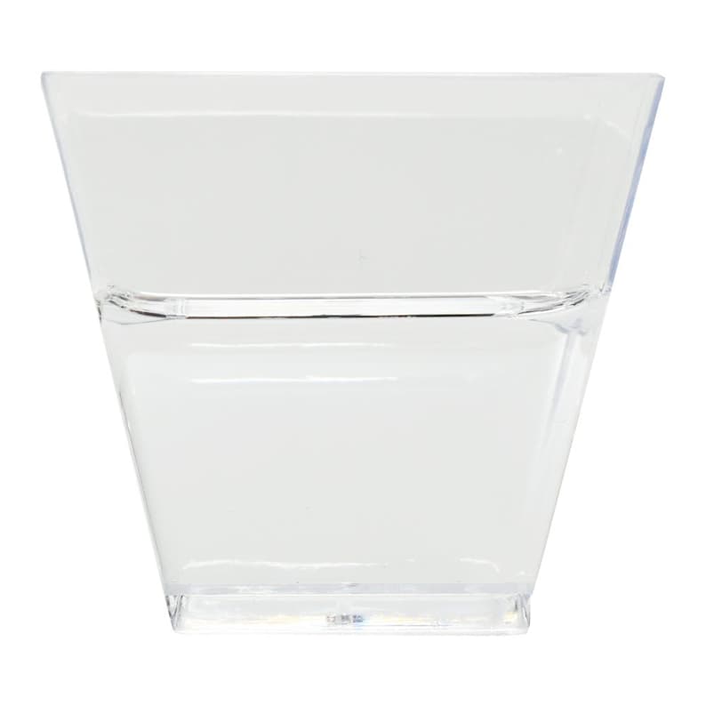 May include: A clear, square-shaped plastic container with a slightly flared top. The container has a horizontal line near the top, creating a subtle design element. The transparent material allows for full visibility of the contents.