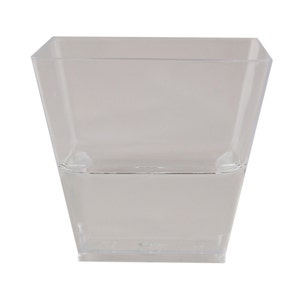 May include: A clear, square-shaped plastic cup with a slightly tapered design. The cup is transparent, allowing visibility of any contents. Ideal for serving small portions of food or beverages.
