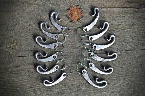 A blacksmith actually hammered this bottle opener keychain out of steel — you can see the forge marks, and it doubles as a daily-carry key fob.