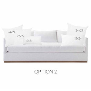 May include: A white sofa with four pillows. The pillows are labeled with their dimensions: 24x24, 22x22, 12x21, and 12x24. The text "OPTION 2" is below the sofa.
