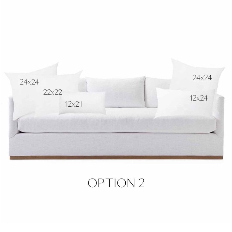 May include: A white sofa with four pillows. The pillows are labeled with their dimensions: 24x24, 22x22, 12x21, and 12x24. The text "OPTION 2" is below the sofa.