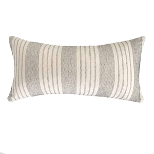 May include: A long, rectangular pillow with a white background and thin black stripes. The pillow is made of a soft, woven fabric.