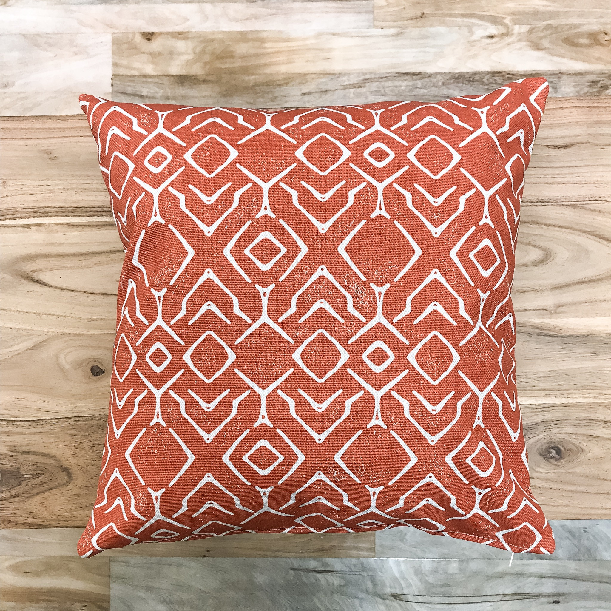 orange ikat pillow