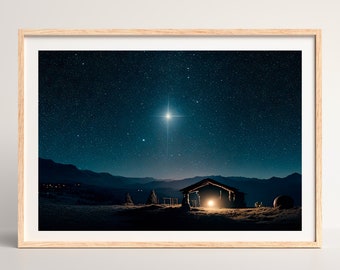 May include: A digital art print of a dark blue night sky with a bright star shining over a silhouette of a wooden stable. The stable is lit from within, and there are mountains in the distance.
