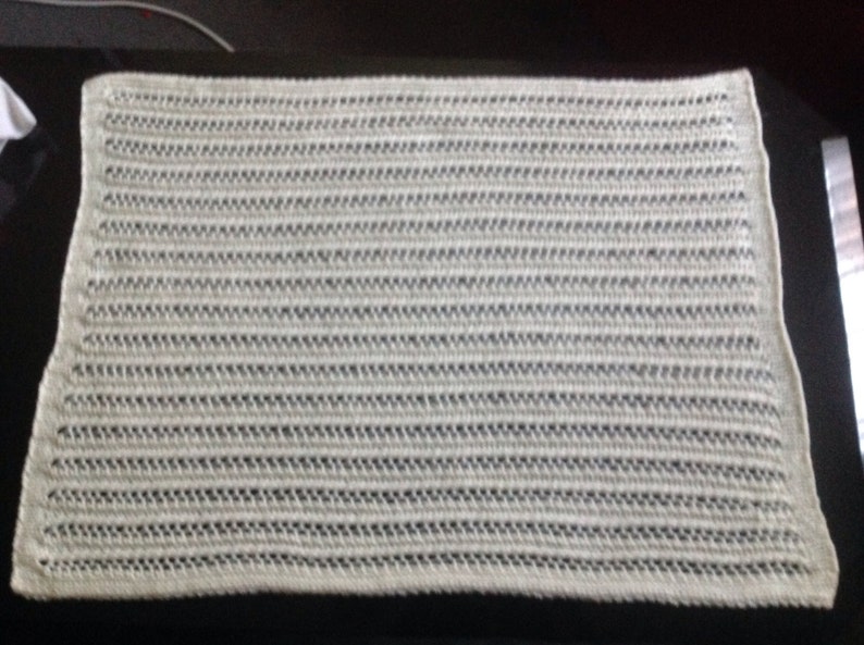 Nice and soft handknitted off white baby blanket
