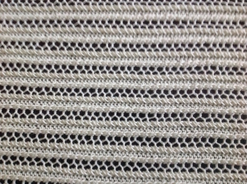 Nice and soft handknitted off white baby blanket