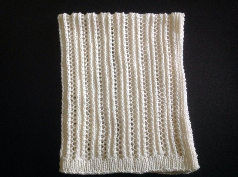 Nice and soft handknitted off white baby blanket