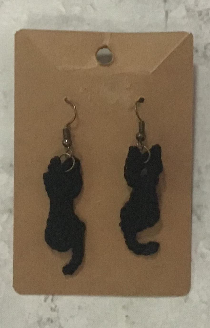 Beautiful and fun black kitten crochet earrings.
