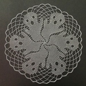 Crochet doily with ghosts image 1