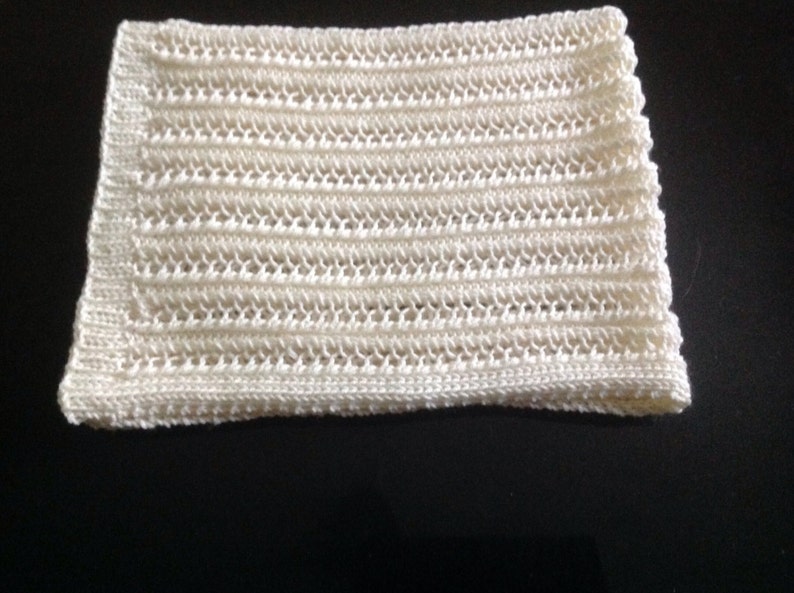 Nice and soft handknitted off white baby blanket