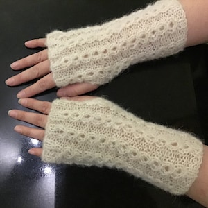 With brushed alpaca silk knitted warm and soft fingerless gloves with a beautiful pattern.