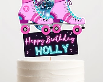 May include: A cake topper featuring pink roller skates with the number 10, a disco ball, and a sign that reads "Happy Birthday HOLLY" in neon colors. The topper is designed for a birthday celebration.