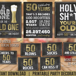 May include: Printable party decorations for a 50th birthday. The signs feature a chalkboard background with gold text and graphics. Some of the signs say "A Cold One for the Old One", "50 Years", "Holy Sh*t You're Old", "Cheers to 50 Years", "50 Blows", "50 Rocks", "50 Sucks", "50 Can Kiss It", and "50 And Still Hot".