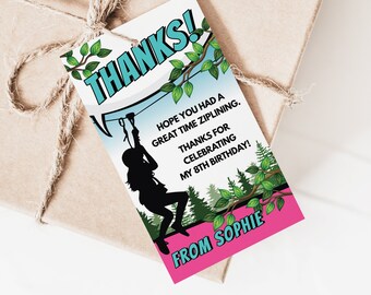 May include: A pink and blue thank you tag with a silhouette of a person ziplining through a forest. The text reads "THANKS! HOPE YOU HAD A GREAT TIME ZIPLINING. THANKS FOR CELEBRATING MY 8TH BIRTHDAY! FROM SOPHIE".