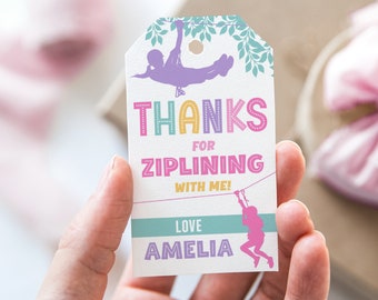 May include: A white thank you tag with a colorful "Thanks for Ziplining with me! Love Amelia" message. The tag features a silhouette of a person ziplining with a green leafy background.