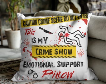 May include: White square cushion with a humorous crime scene design. The cushion features the text "CAUTION CRIME SCENE DO NOT ENTER", "This is my Crime Show Emotional Support Pillow", a knife, a chalk outline, and blood splatter.