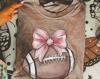 Comfort Colors® Pink Coquette Football Shirt, Football Mom Shirt, Sports Mom Gift, Gameday Shirt, Football Gift Shirt, Football Bow Tee