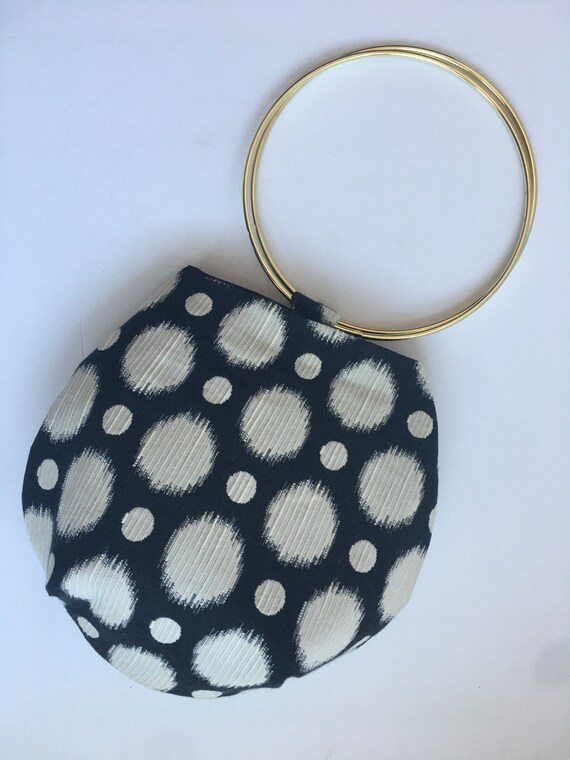 gold ring handle clutch bag