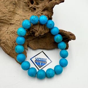 Pulsera de turquesa estabilizada por compresión de calidad AAA de 10 mm Pulsera de turquesa de forma redonda Pulsera de joyería de turquesa estabilizada
