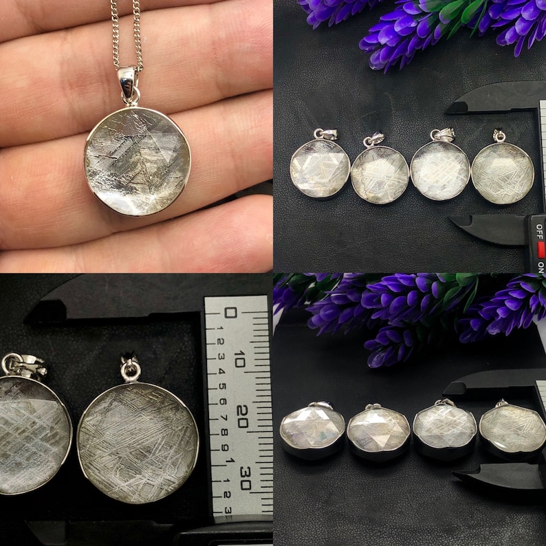 May include: A set of six silver pendants featuring a round, white, and gray stone with a unique, textured pattern. The pendants are shown on a black surface with a ruler for scale.