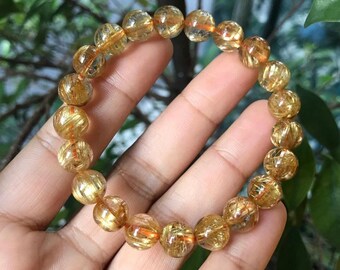 Bracelet perlé rond en quartz rutilé doré naturel pour homme et femme disponible en 6 mm 8 mm 10 mm 12 mm