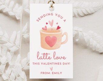 May include: A white gift tag with pink watercolor hearts and a pink coffee mug with the text "Sending you a latte love this Valentines Day! From: Emily".