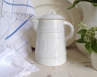 A rare Edwardian hot water jug with lid