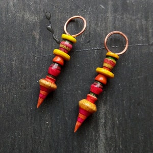 A pair of Stripe Painted, Turned look, Faux ceramic, Rustic, Tribal style Spikes in Yellow, red, pink and orange image 1