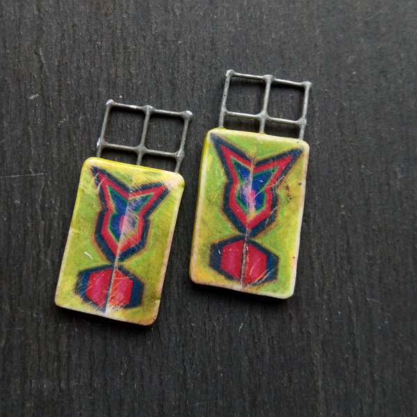 A pair of Small, Abstract Pattern, Flat, Wire and Polymer, symmetrical, distressed Image transfer tile bead drops in Green, red and blue