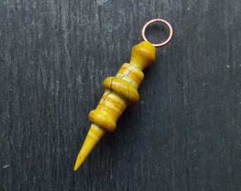 A Single, Turned look, Rounded, distress painted Spike Charm in Green and brown