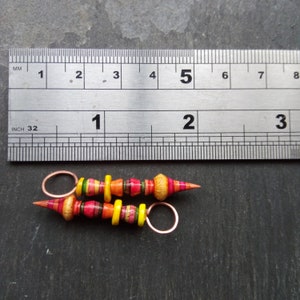 A pair of Stripe Painted, Turned look, Faux ceramic, Rustic, Tribal style Spikes in Yellow, red, pink and orange image 3
