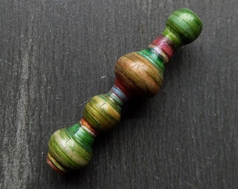 A Large, Single, Turned look, Stripe painted, Metallic finish, Tribal style Tube bead, A Simple spindle drop bead in Green, pink and bronze