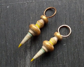 A pair of Stripe Painted, Turned look, Faux ceramic, Rustic, Tribal style Spikes in grey, yellow, blue and metallic gold