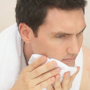 Handsome man washing his face with a soft flannel Fairface Washcloths for sensitive skin