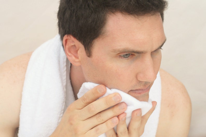 Handsome man washing his face with a soft flannel Fairface Washcloths for sensitive skin