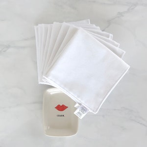Fairface Washcloths made with soft white flannel, gentle for rosacea and sensitive skin displayed with cute charm soap dish