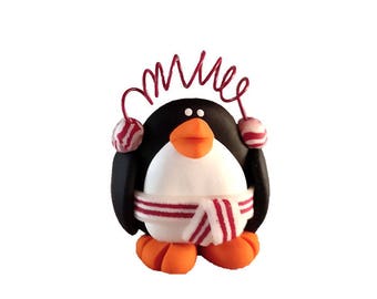 Penguin with ear muffs ornament