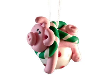 Pig on ball ornament