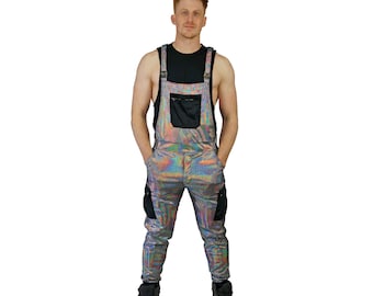 May include: A pair of iridescent silver overalls with black straps and pockets. The overalls have a relaxed fit and are made of a lightweight, comfortable fabric.