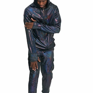 May include: A black iridescent hooded sweatshirt and matching pants. The sweatshirt has a zipper closure and the pants have cargo pockets.
