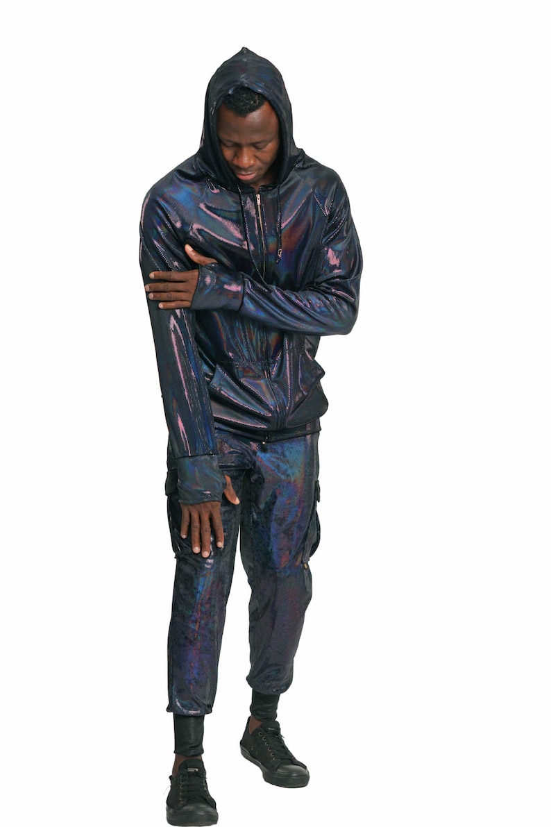 May include: A black iridescent hooded sweatshirt and matching pants. The sweatshirt has a zipper closure and the pants have cargo pockets.