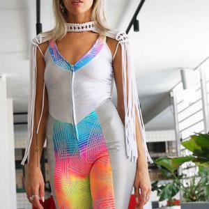 Neon rainbow spandex with geometric patterns, holographic white, and reflective silver womens sleeveless festival catsuit by Love Khaos