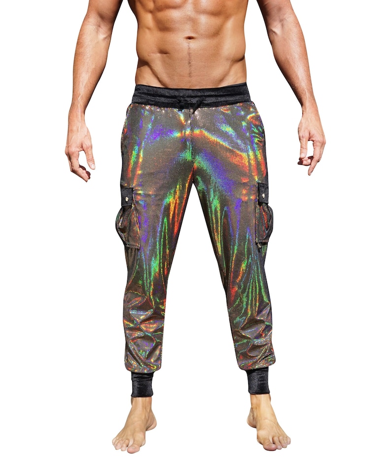 May include: Black and iridescent joggers with a drawstring waist and side pockets. The joggers have a black velvet waistband and black trim at the ankles.