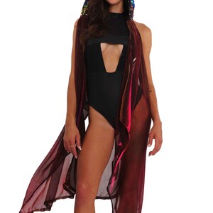 May include: A long, sheer, burgundy-colored shawl with a sequined hood. The hood has iridescent sequins in shades of pink, green, blue, and purple.