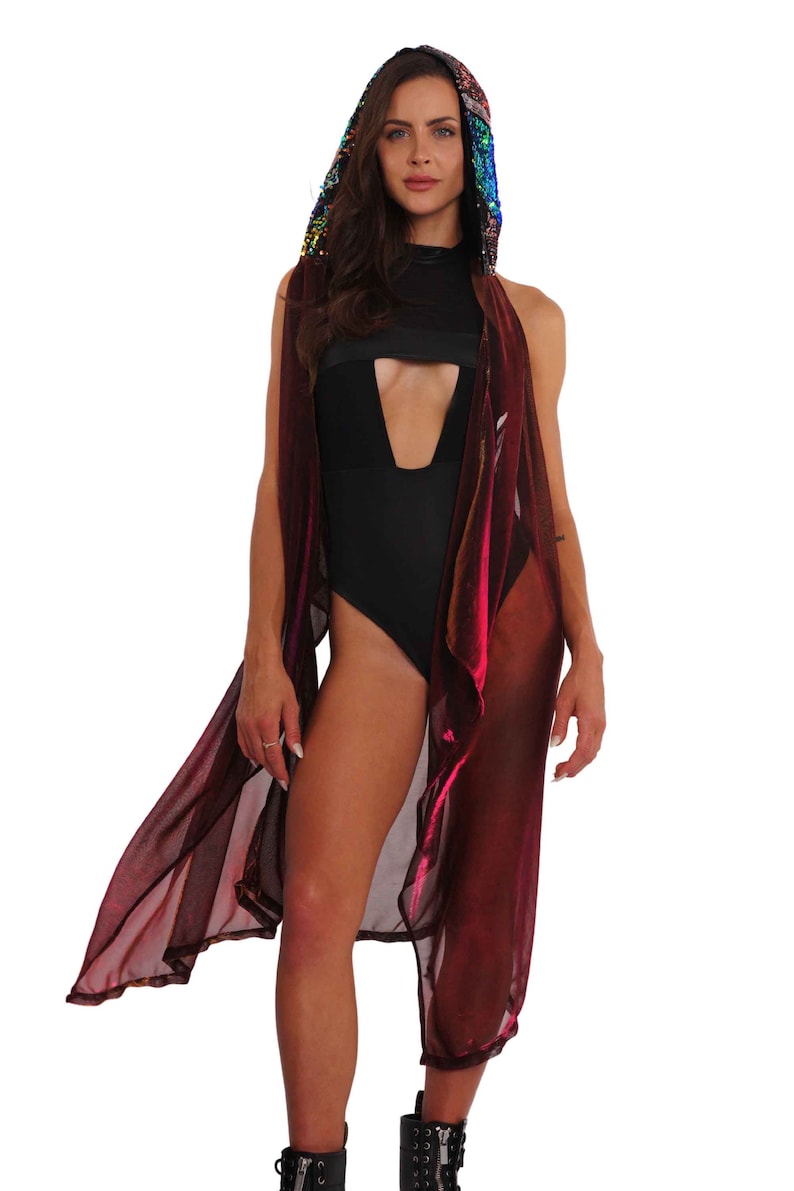 May include: A long, sheer, burgundy-colored shawl with a sequined hood. The hood has iridescent sequins in shades of pink, green, blue, and purple.