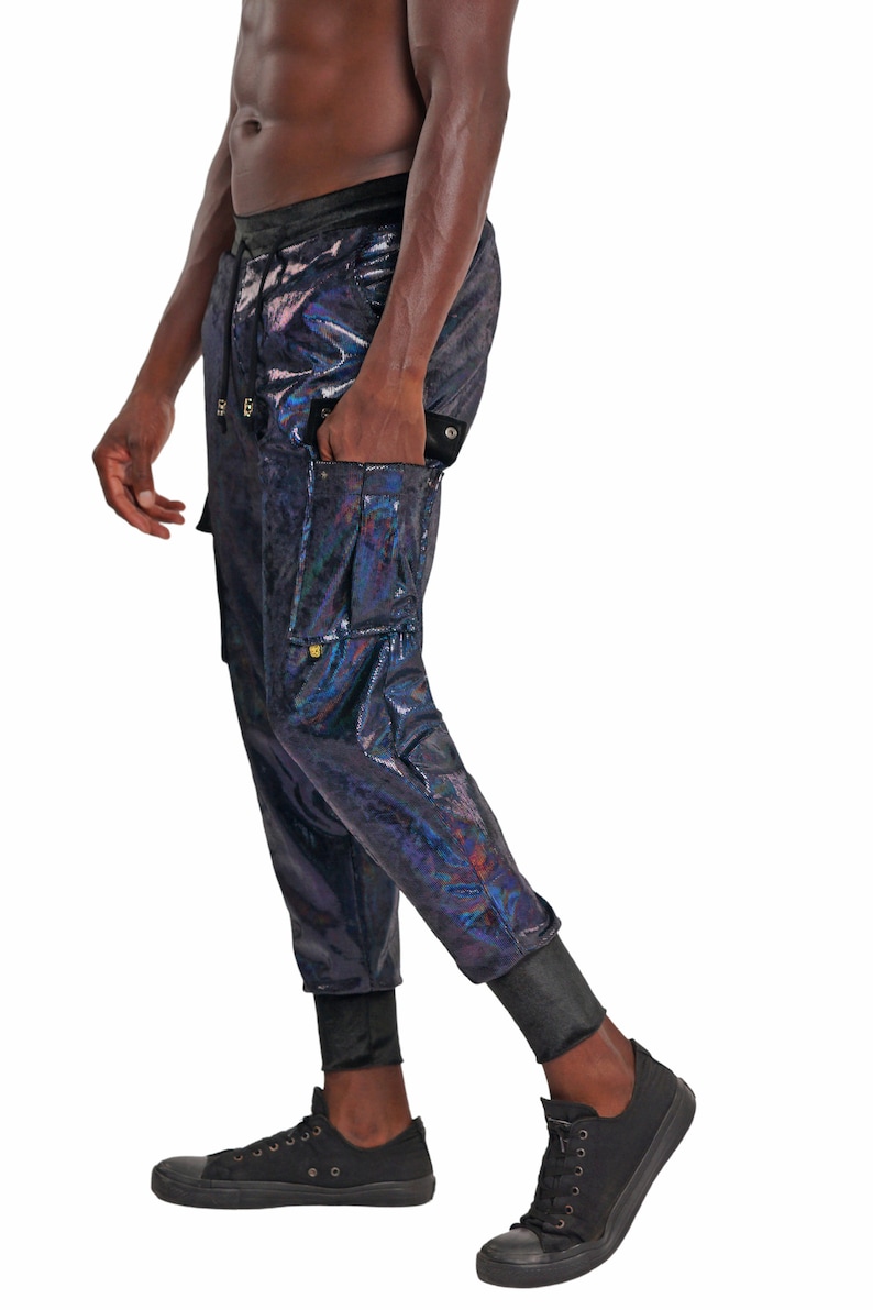 May include: Black cargo pants with a iridescent sheen. The pants have a drawstring waist and multiple pockets.