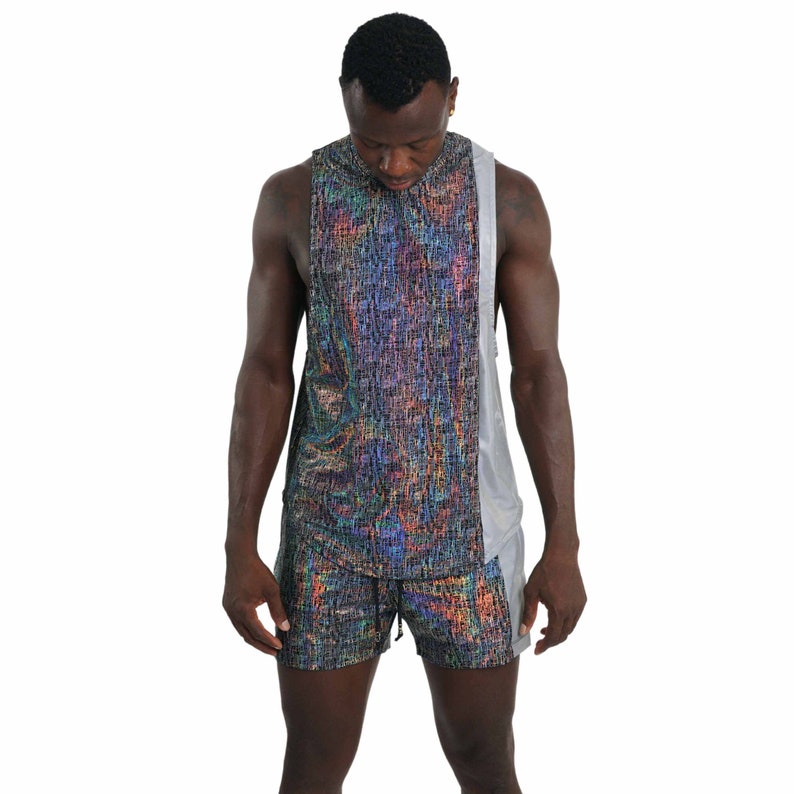 May include: A sleeveless shirt and matching shorts with a colorful iridescent pattern. The shirt has a silver panel on the side.