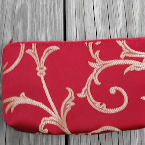 cosmetic bag, toiletry bag, special occasion bag, makeup bag, small bag, zippered bag, fashion accessory, wardrobe accessory, cranberry bag
