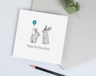 Cartão de aniversário dos coelhinhos com nome e idade personalizados.