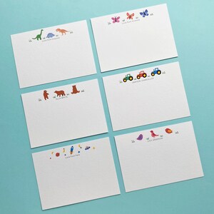 May include: Set of six blank note cards with colourful illustrations and personalised names. The illustrations include dinosaurs, butterflies, bears, tractors, birds and rockets.